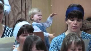Little girl conducting a church choir