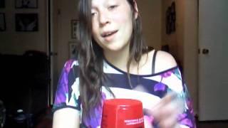 Girl sings and uses a cup like an instrument